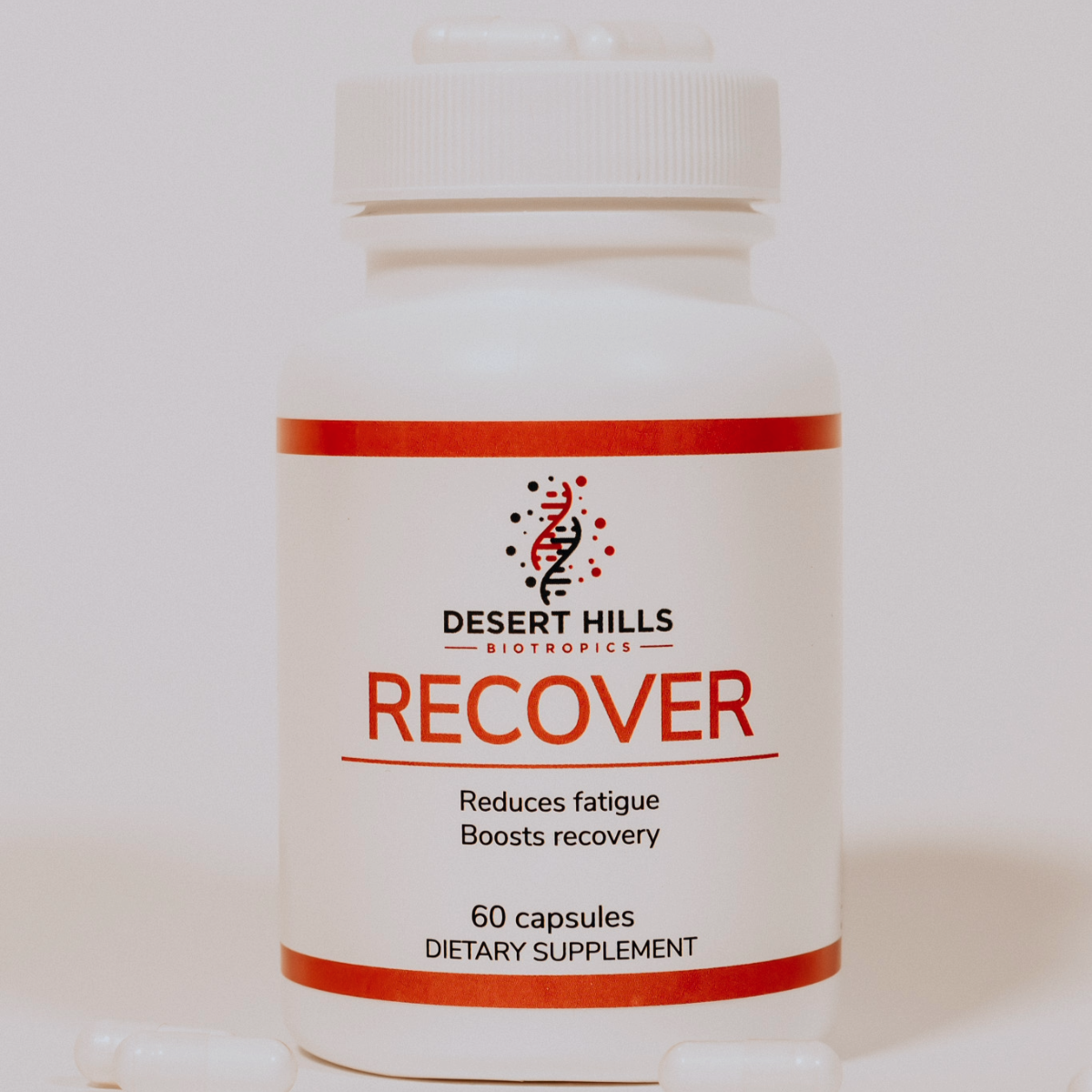 Desert Hills Recover BPC-157 peptide capsules supplement bottle with capsules scattered around the bottle on a light background
